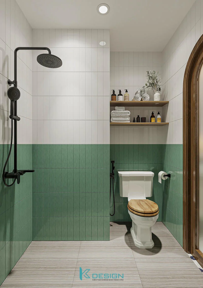 Nhà vệ sinh cho căn hộ với gạch ốp chân tường màu xanh tạo điểm nhấn